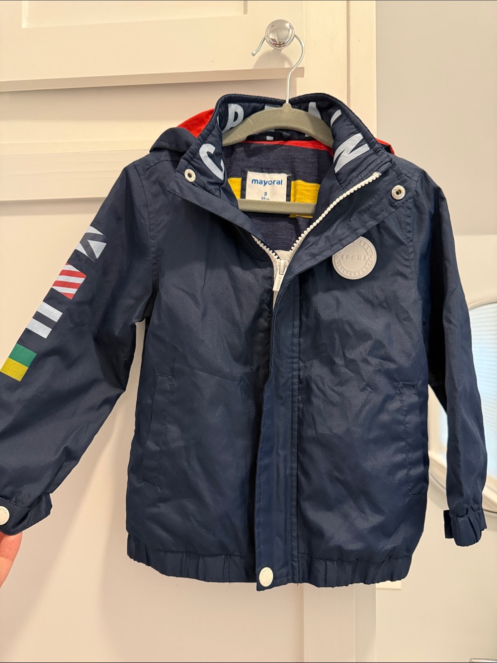 Mayoral Navy Hooded Raincoat with Colorful Sleeve Flags